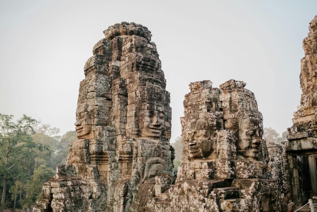Ancient stone faces of Bayon Temple, a historic Khmer landmark in Cambodia.